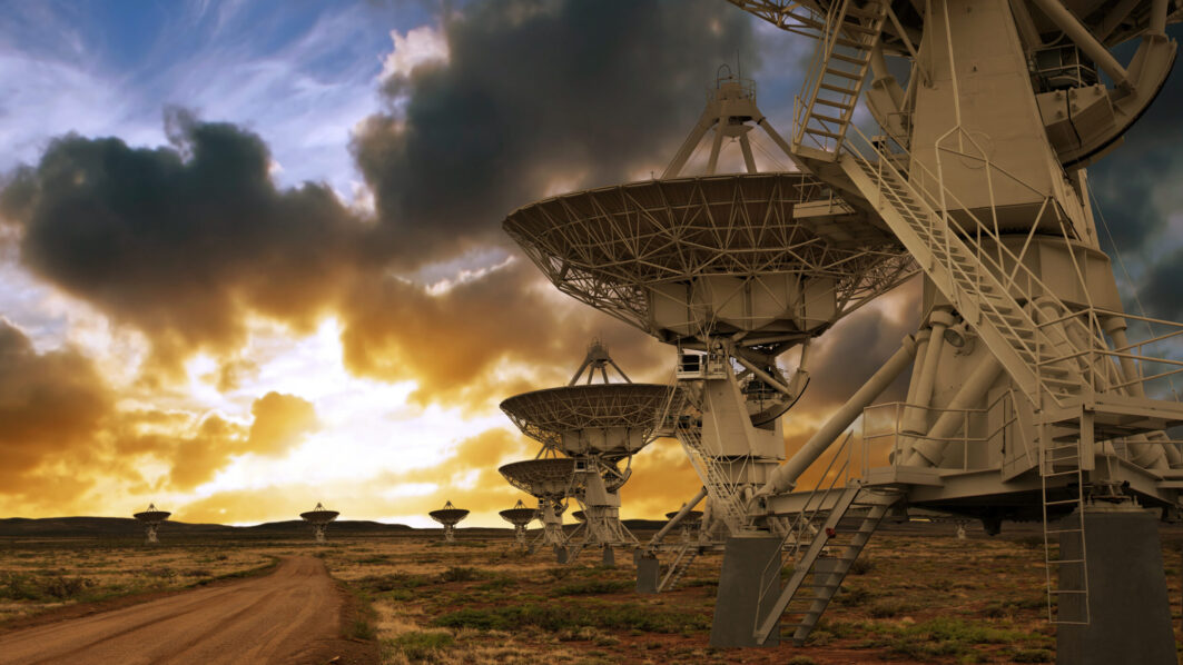 large radio telescope satellite dishes at sunset, panoramic frame (XL)