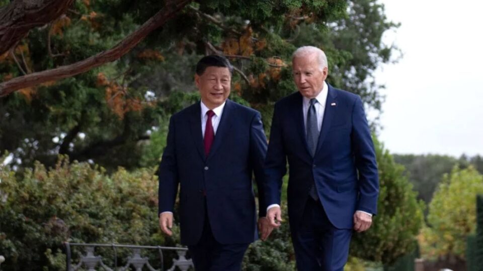 U.S. President Joe Biden (right) and Chinese President Xi Jinping walk together after a meeting in Woodside, California, on Nov. 15, 2023, during the Asia-Pacific Economic Cooperation leaders' week.