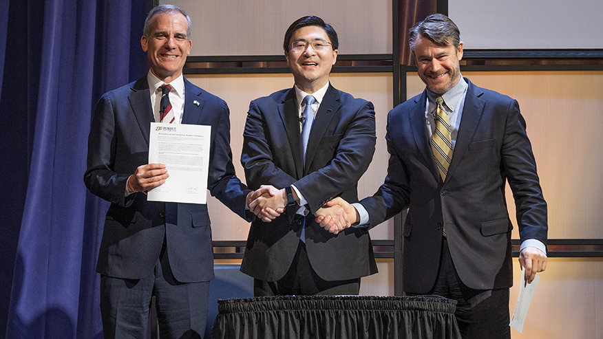 Purdue President Mung Chiang with (left) Eric Garcetti, U.S. ambassador to India, and U.S. Sen. Todd Young